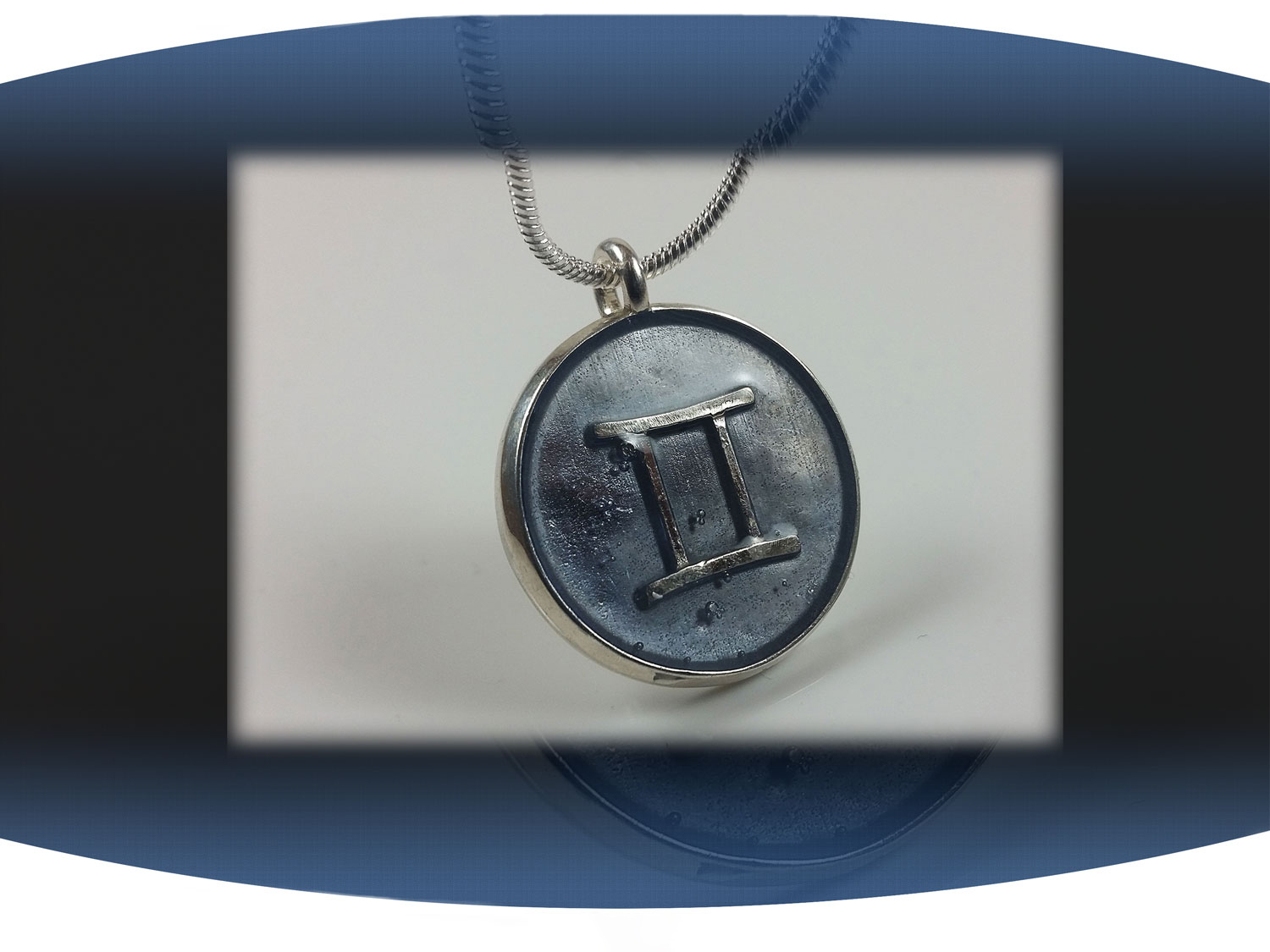 Sterling silver zodiac sign  gemini pendant with light blue resin and star constellation on the back