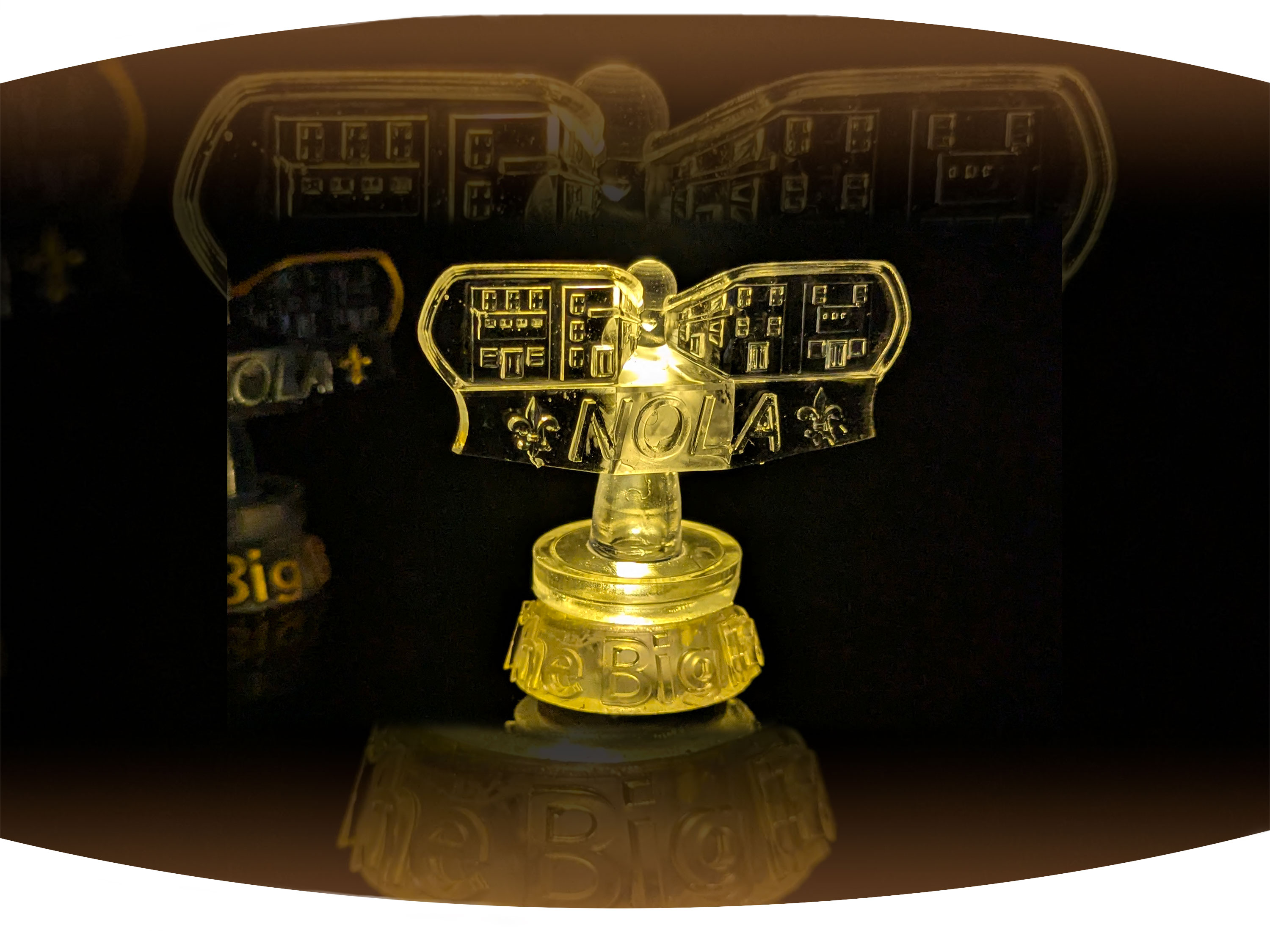 Close up of white screen printed  t-shirt with the black text Bywater with red stamp across it that says gentrified