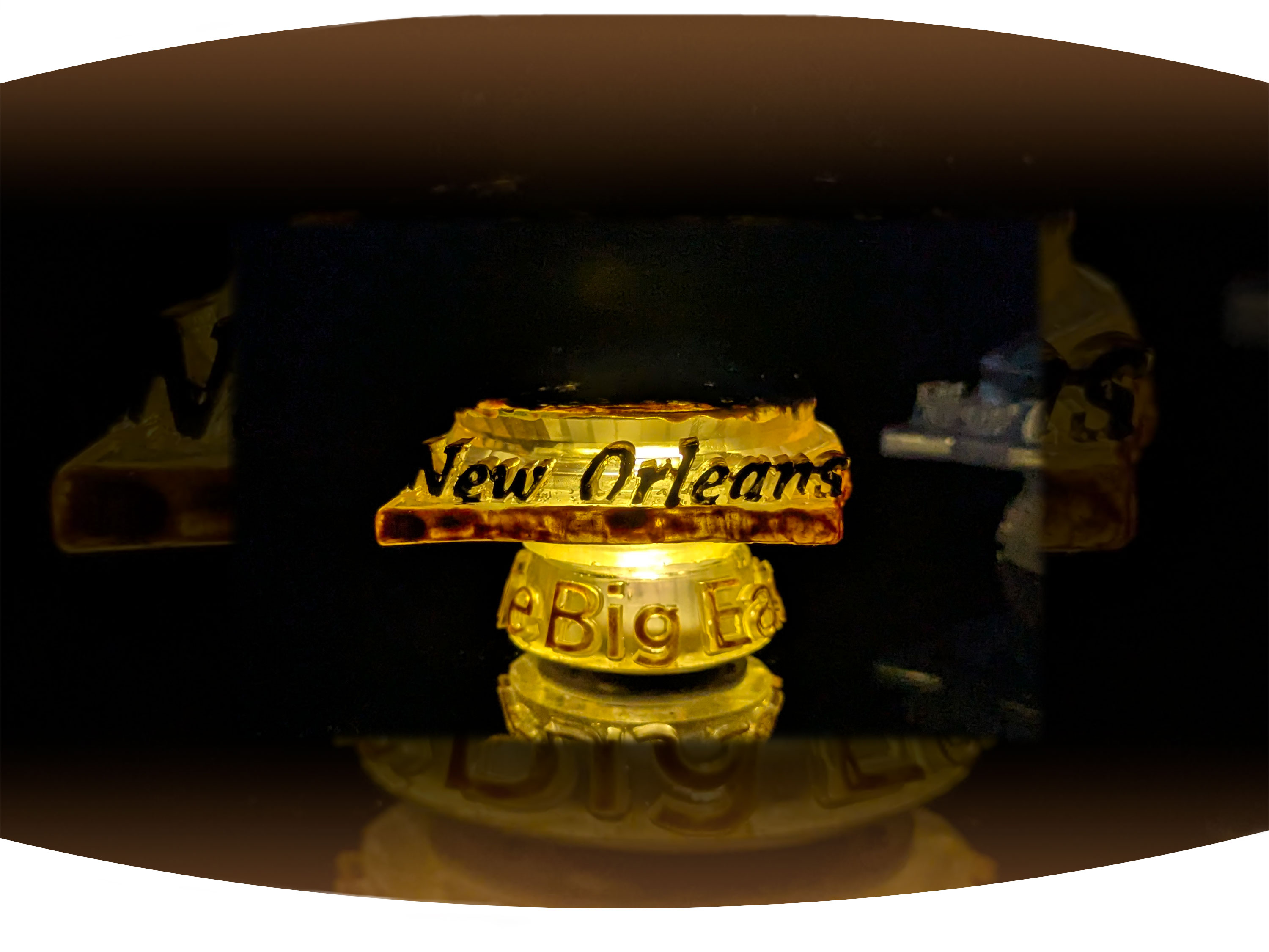 White screen printed  t-shirt with the black text Bywater with red stamp across it that says gentrified